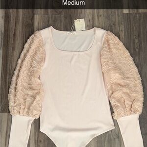 Cream bodysuit with sleeve details